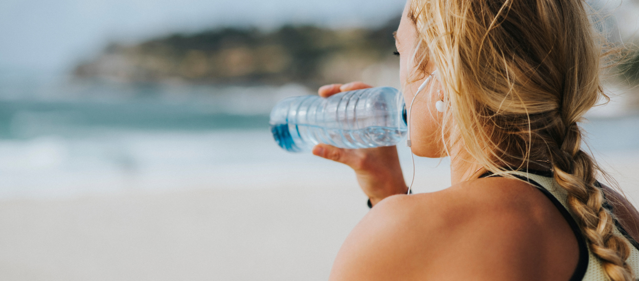 women drinking electrolytes